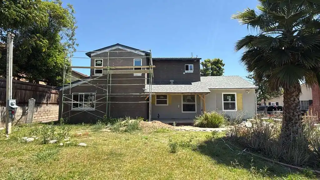 Home addition in San Gabriel second story construction with scaffolding